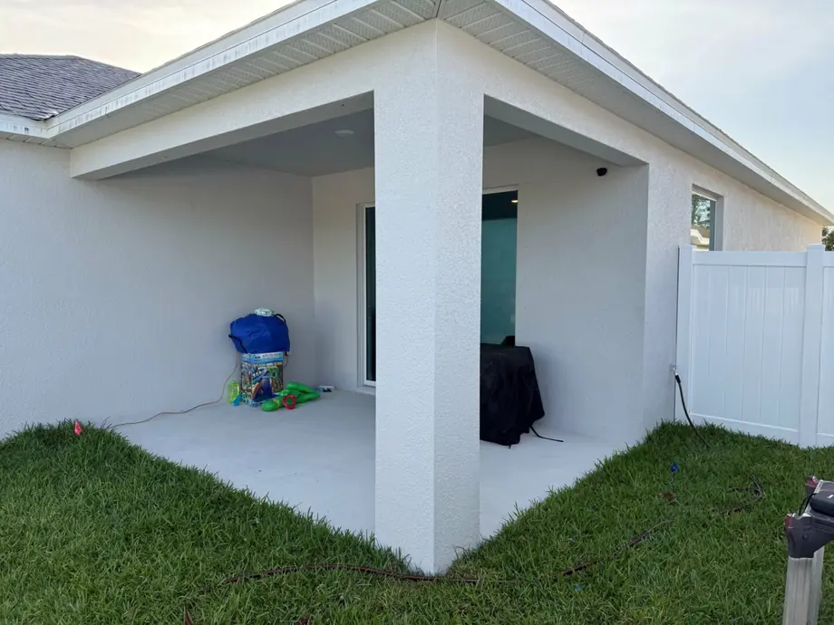 Screened back porch enclosure on a home in Hudson, Florida