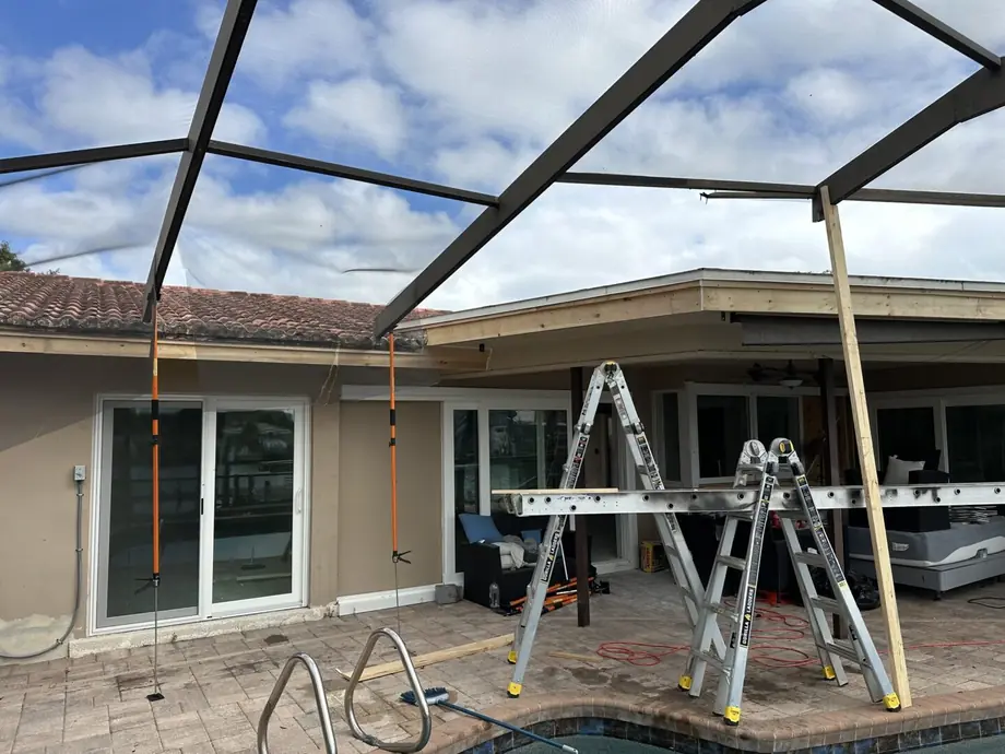 New screen enclosure and super gutter installation completed on a Florida home
