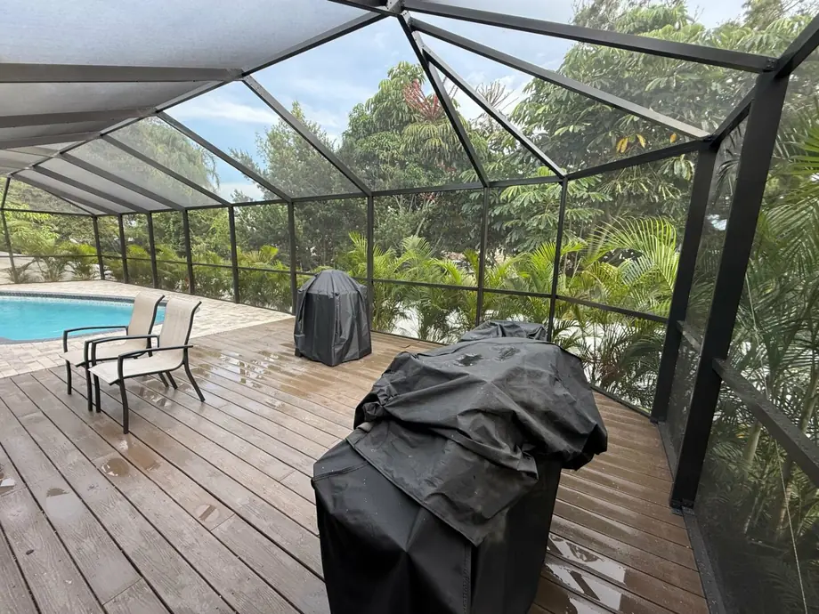 Completed pool cage rescreen with clean, evenly tensioned panels