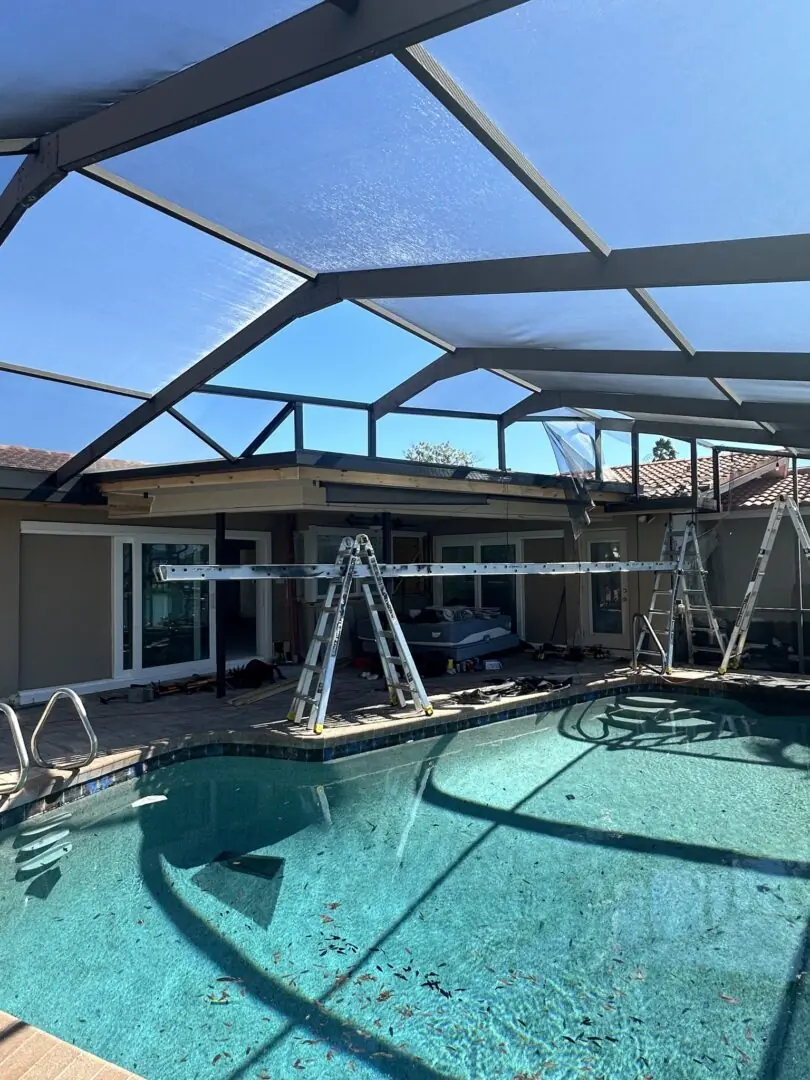 Finished screen room enclosure attached to the rear of a Tampa Bay home