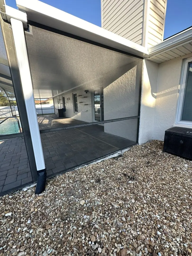 Screened back porch enclosure on a home in Hudson, Florida