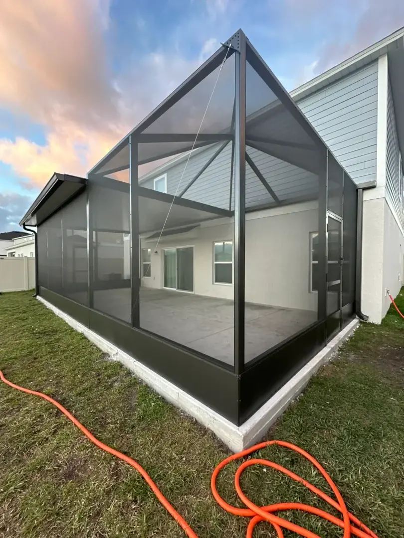 Permanent aluminum shade structure covering an outdoor seating area